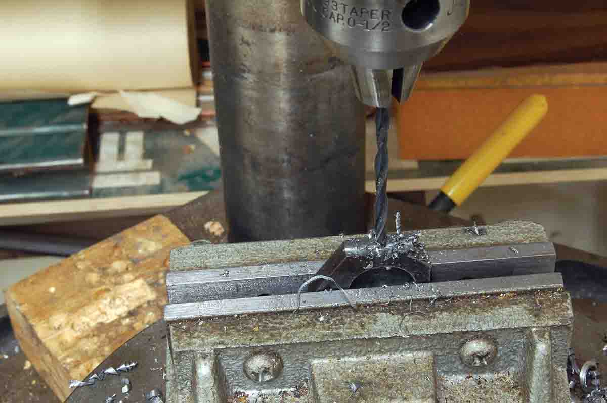 A hole for the forearm anchor screw is drilled and tapped 8x32 tpi.